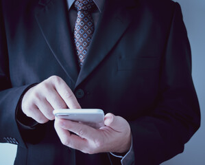 businessman holding a phone
