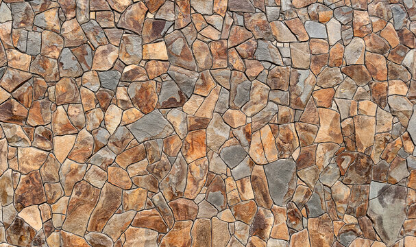 Graphics of brown chipped stone decorated the foundation of the house.Background.