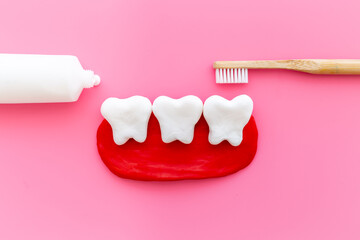 Oral health and care concept - clean teeth models with toothbrush