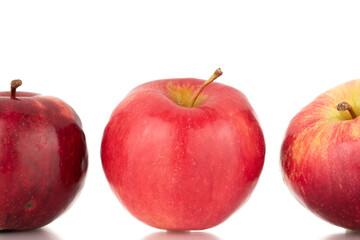 Fototapeta na wymiar Three ripe red apples, macro, isolated on white background.
