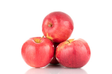 Three ripe red apples, macro, isolated on white background.