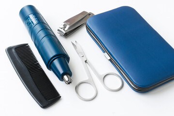 A set of tools for men's body care: nose trimmer, scissors, wire cutters, comb. Manicure set.