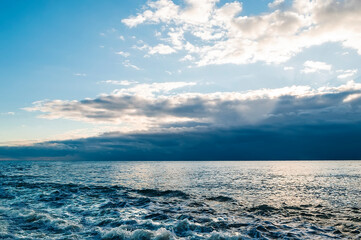 A mesmerizing view of a beautiful seascape under a cloudy blue sky