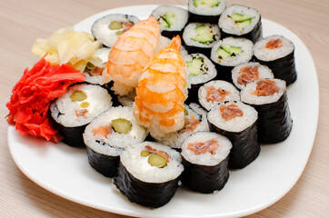 Mix of sushi and rolls, close-up. Japanese traditional food. Raw fish dishes