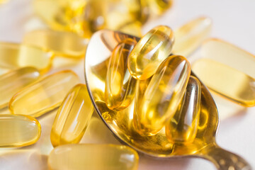 omega 3 vitamins yellow capsules close