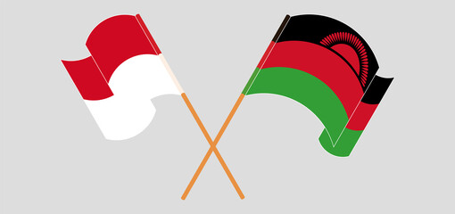 Crossed and waving flags of Monaco and Malawi