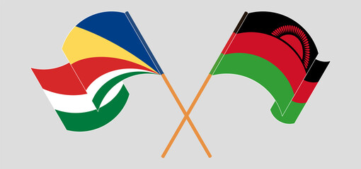 Crossed and waving flags of Seychelles and Malawi