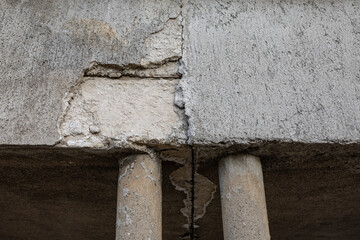 Zagreb, Croatia - February 2021. Texture of an old cracked dilapidated worn wall with pillars
