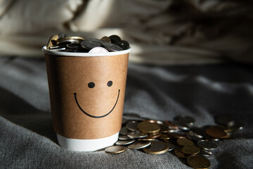 paper coffee cup with money