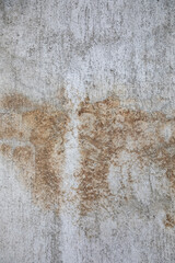 Zagreb, Croatia - February 2021. Texture of an old cracked dilapidated worn wall with stains as a backdrop