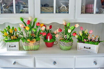 Artificial flower decoration on white furniture