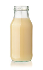 Open glass bottle of organic banana juice