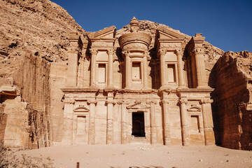 Facade of the temple in the ancient city of Petra. Jordan. Temple in red sandstone rock on a clear sunny day