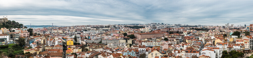 Fototapeta na wymiar Lisbon, Portugal - 12 27 2018: Extra large panoramic view of the city skyline taken from the Miradouro do Recolhimento