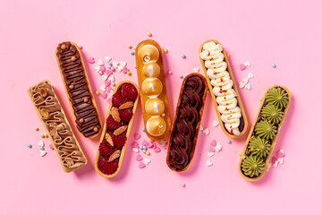 Sweet food pattern of eclairs with color topping. Sweet shacks