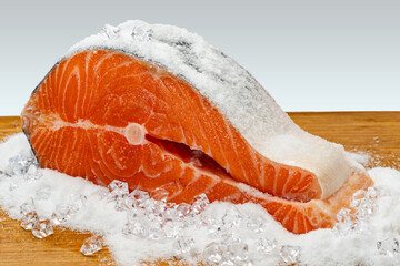 Chilled salmon large piece, fillet, steak. Fresh raw trout fish. Red meat healthy seafood