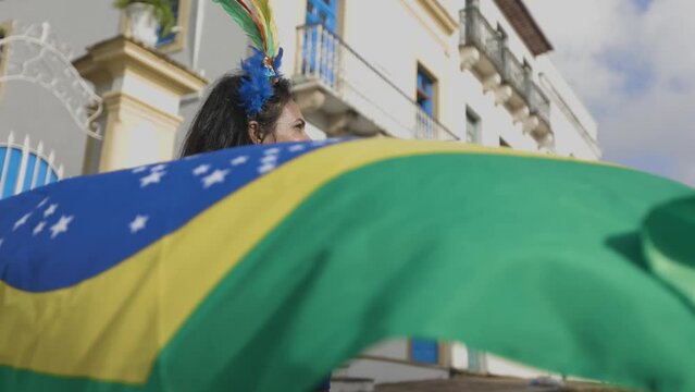 Beautiful fun of the Brazilian soccer team celebrating in the street. Dressed in the colors of Brazil.
