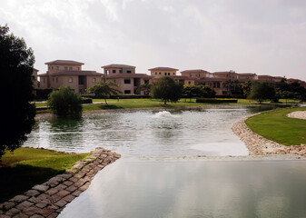 Obraz premium Villas at Madinaty compound with lake view, luxury living