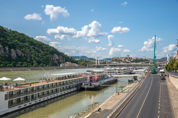 Fototapeta na wymiar The pleasure boats on Danube river in Budapest, Hungary