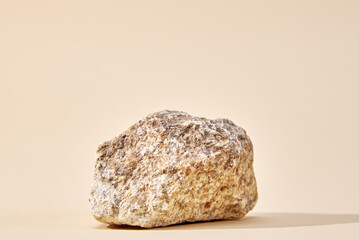 Natural granit stone on beige background, minimal product podium