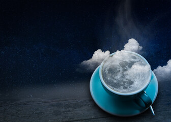 a cup of coffee with the moon and clouds on the background of the night sky. copyspace. The concept of inspiration and creativity.