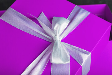 Present. Purple big box with white bow.