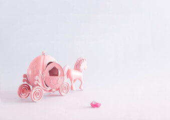 Pink carriage and horse. Girl's toys in creative arrangement. Classic brothers Grimm fairy tale...