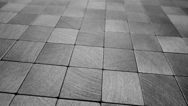 Abstract squares background. Metal surface consisting of square plates.