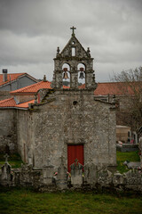 Facade of a village chapel with a cemetery typical construction of small parishes in the interior of Galicia