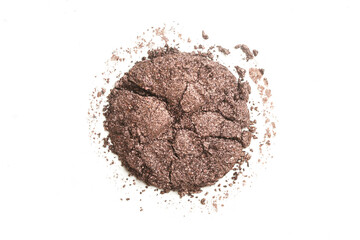 Smashed brown makeup sample isolated on white background