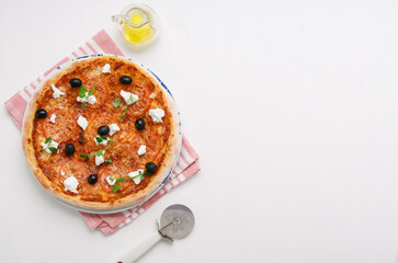 homemade pizza with tomatoes, olives and young cheese.