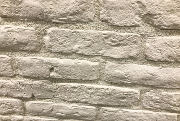 Obraz premium decorative brick for wall covering, texture. white tile bricks, stucco tiles, small bricks for wall covering. stucco bricks made of cement material