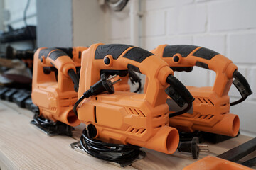 Background image of electric power tools in woodworking workshop, copy space