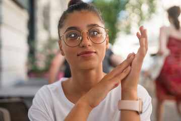 Portrait close up of young beautiful girl, on street