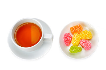 Tea cup and sweets isolated on white background.