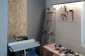 Background image of tools and equipment in garage workshop, copy space