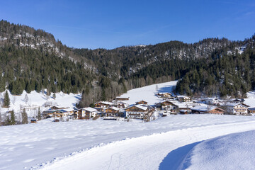 houses of a mountain village during winter with a lot of snow