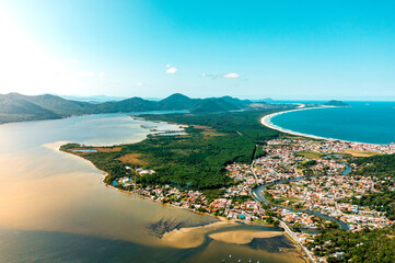 aerial photo with drone of mozambique beach, barra da lagoon and conceição lagoon in the afternoon in florianópolis Santa Catarina Brazil - obrazy, fototapety, plakaty