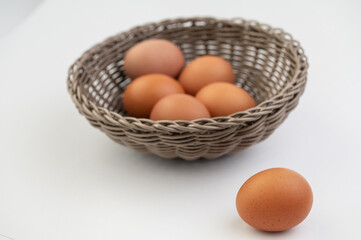 Closeup of fresh brown eggs in Easter basket
