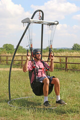 Paraglider in a hang frame