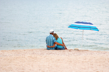A Happy couple spend time on the seaside camping