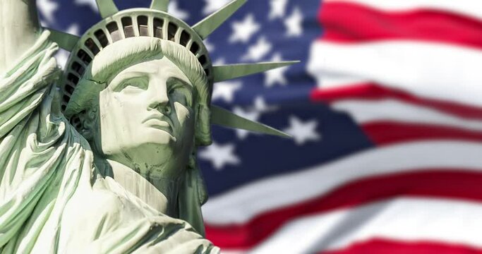 the statue of liberty with blurred american flag waving in the background. Democracy and freedom concept.