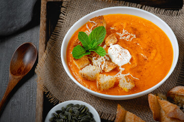 Pumpkin soup with croutons and cream