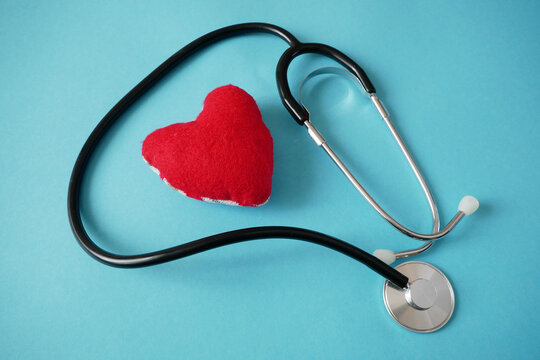 stethoscope and heart symbol on blue background. american heart month in February,