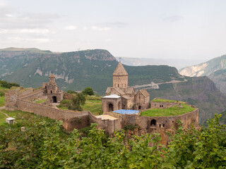 Fototapeta premium Tatev monastery on the rocky edge of the mountain