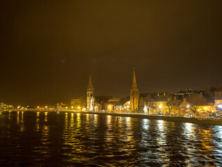 Night view of river Ness with Inverness city lights reflecting