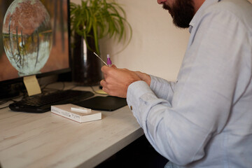 Anonymous person opening an extraction tube