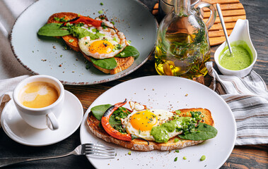 hearty and high-calorie breakfast. delicious and mouth-watering bruschetta with fried eggs and herbs for breakfast with a cup of aromatic coffee.