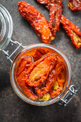 Sun dried tomatoe. Pickled tomatoes in jar.