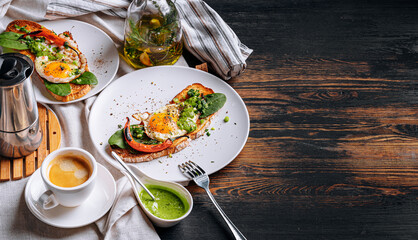 hearty and high-calorie breakfast. delicious and mouth-watering bruschetta with fried eggs and herbs for breakfast with a cup of aromatic coffee.